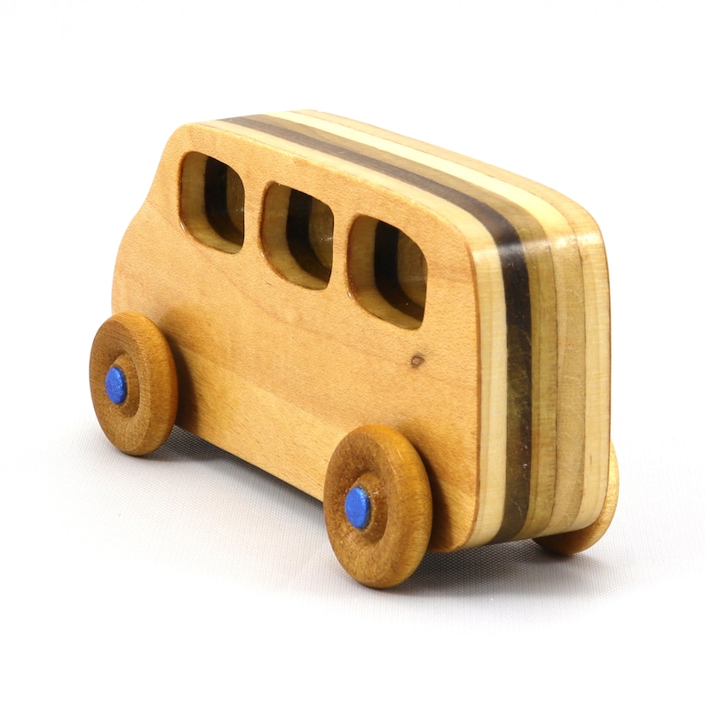Handmade wood toy minivan made by me in my shop using traditional woodworking tools. It is hand finished with clear shellac with metallic sapphire blue acrylic paint.