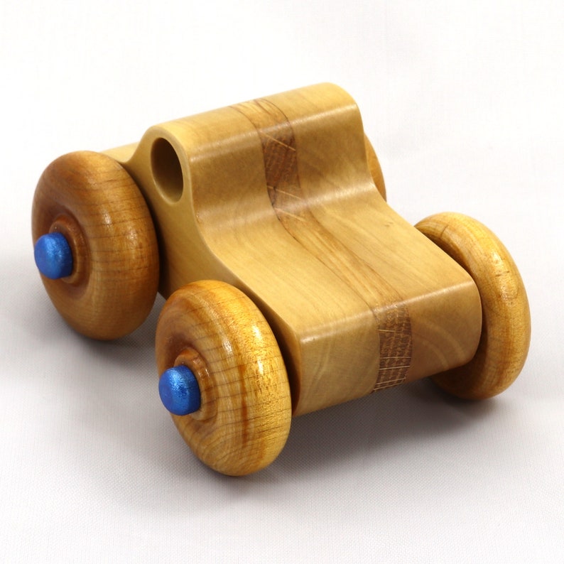 Handmade wooden toy pickup truck with a durable satin polyurethane finish and metallic sapphire blue trim from My Play Pal collection.