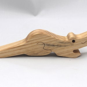 Handmade Wood Alligator Family Stacking Puzzle Mom and five baby (hatchling) alligators. This freestanding puzzle is hand-finished with a custom blend of mineral oil and waxes for a beautiful, smooth, and durable finish.