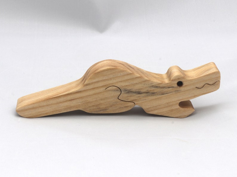 Handmade Wood Alligator Family Stacking Puzzle Mom and five baby (hatchling) alligators. This freestanding puzzle is hand-finished with a custom blend of mineral oil and waxes for a beautiful, smooth, and durable finish.