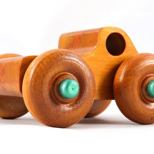Wood Toy Monster Pickup Truck handmade in the USA from select hardwood finished with amber shellac with metallic emerald green trim. From my Play Pal Collection.