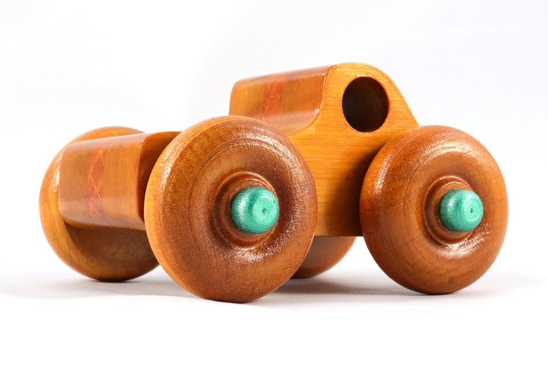 Wood Toy Monster Pickup Truck handmade in the USA from select hardwood finished with amber shellac with metallic emerald green trim. From my Play Pal Collection.