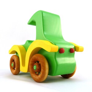 Handmade wooden toy car, vintage-style Model T sedan, painted bright green and yellow with spoked wheels, finished in amber shellac.  Handcrafted in Tallahassee, Florida, USA by Odin's Toy Factory.