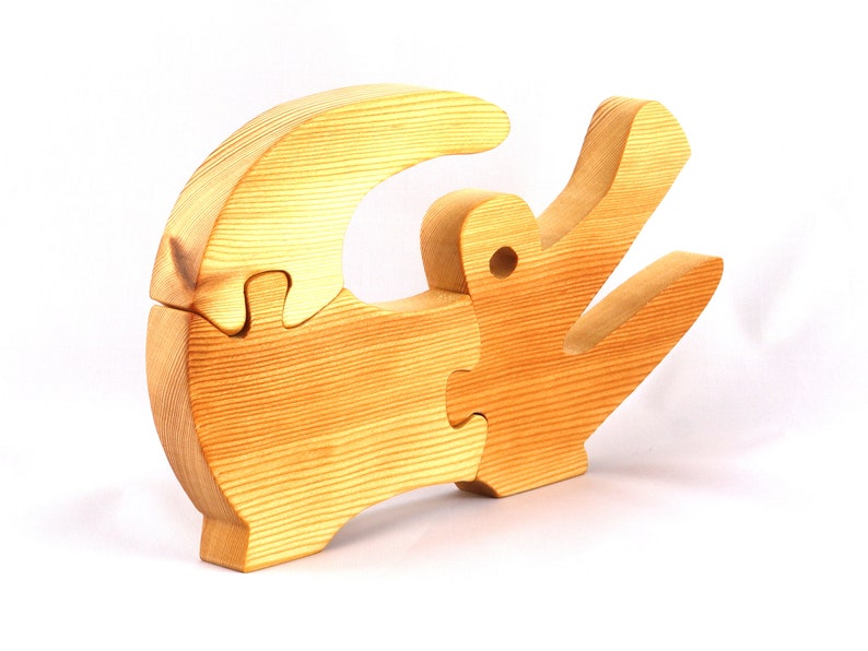 A 10-inch long wooden alligator puzzle for younger kids handmade and smoothly finished. This simple puzzle has three pieces, easy-to-grasp, interlocking, chunky, freestanding pieces. It is made to order.