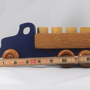 This handmade wooden Lorry truck is finished with navy blue acrylic paint and Amber Shellac. It is one of five towable trucks in this collection, available in many colors and unfinished. Custom Orders are welcome.