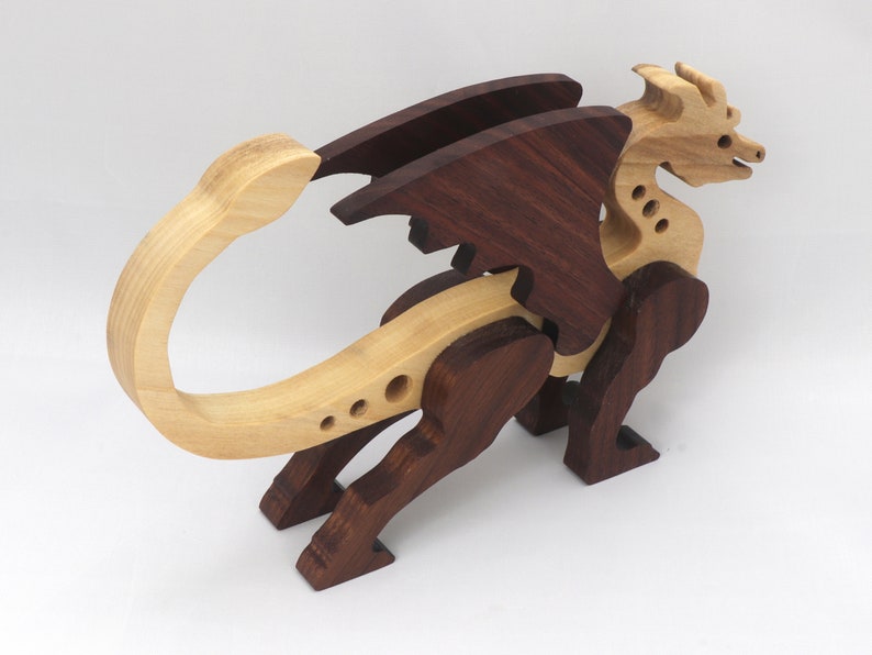 Handmade wood dragon figurine made from select grade contrasting hardwoods and hand-finished with a custom mixture of mineral oil and waxes.