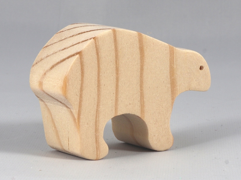 This is an unfinished wooden bear cutout from solid wood using traditional woodworking techniques. Sanded smooth and ready to paint, stain, or customize. Freestanding design for small hands, toddlers, young children, crafters, collectors, and display. I take custom orders for any animal, quantity, and mix — including large ornament orders. Mix and match, request a different size, or send a drawing or pattern. Handmade by Odin's Toy Factory in Tallahassee, Florida, USA.