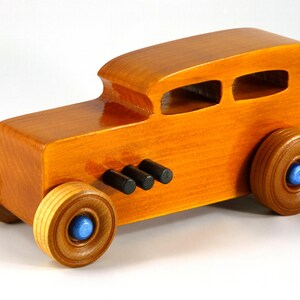 Handmade Wood Toy Car Hot Rod 1932 Sedan Finished With Amber Shellac And Trimmed With Metallic Saphire Blue And Black Acrylic Paint From My Hot Rod Collection
