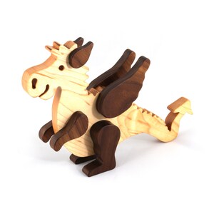 Handmade wood baby dragon fantasy animal figurine made from select grade contrasting hardwoods and hand finished with a durable custom blend of mineral oil and waxes.