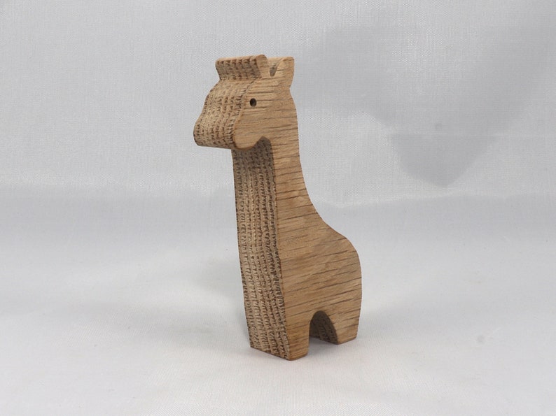 Handmade wooden giraffe cutout, unfinished, ready to paint, and freestanding. Perfect for a young child's imaginative play, stacking, or crafting.
