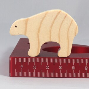 This is an unfinished wooden bear cutout from solid wood using traditional woodworking techniques. Sanded smooth and ready to paint, stain, or customize. Freestanding design for small hands, toddlers, young children, crafters, collectors, and display. I take custom orders for any animal, quantity, and mix — including large ornament orders. Mix and match, request a different size, or send a drawing or pattern. Handmade by Odin's Toy Factory in Tallahassee, Florida, USA.