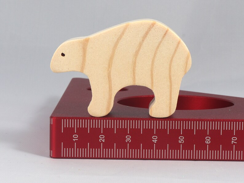 This is an unfinished wooden bear cutout from solid wood using traditional woodworking techniques. Sanded smooth and ready to paint, stain, or customize. Freestanding design for small hands, toddlers, young children, crafters, collectors, and display. I take custom orders for any animal, quantity, and mix — including large ornament orders. Mix and match, request a different size, or send a drawing or pattern. Handmade by Odin's Toy Factory in Tallahassee, Florida, USA.