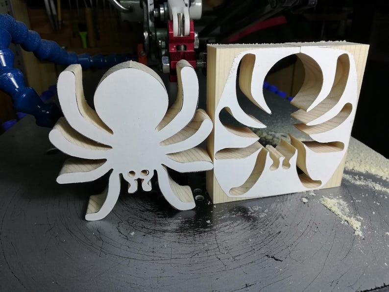 Handmade unfinished wooden Halloween spider cutout from Odin's Toy Factory Snazzy Spooks Collection. Solid wood hand-cut spider, paintable, freestanding design. Approximate size 3.5 inches height by 3.5 inches width by 0.75 inches thick. Made in Tallahassee, Florida, USA.
