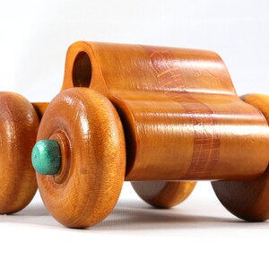 Wood Toy Monster Pickup Truck handmade in the USA from select hardwood finished with amber shellac with metallic emerald green trim. From my Play Pal Collection.