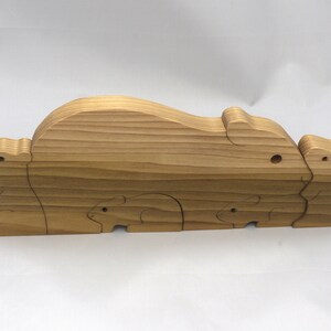 Handmade Wooden Stacking Puzzle Guinea Pig Family, Mom, and Babies finished with a non-toxic custom blend of mineral oil and waxes. This wooden toy animal is perfect for imaginative play and an excellent gift for children.