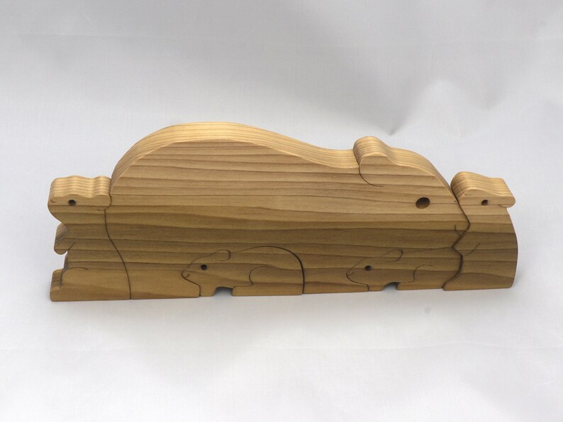 Handmade Wooden Stacking Puzzle Guinea Pig Family, Mom, and Babies finished with a non-toxic custom blend of mineral oil and waxes. This wooden toy animal is perfect for imaginative play and an excellent gift for children.