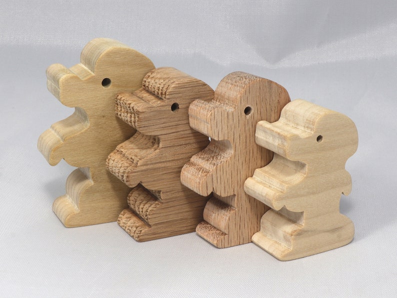 Handmade wood poodle puppy cutout made from unfinished wood. It is sanded and ready to paint. It is freestanding and an excellent pretend toy that can also be used for crafts.