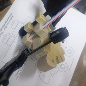 Handmade push toy stegosaurus crafted from select grade hardwoods in my toymakers shop. Legs are being glued on.