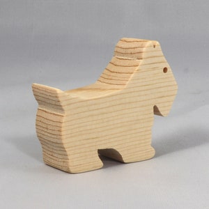 Handmade wood toy Scottie dog cutout unfinished unpainted paintable freestanding Itty Bitty Animal Collection. Approximate size 2.5 inches length by 2 inches height by 0.75 inches width. Handmade in Tallahassee Florida USA from natural wood offcuts.