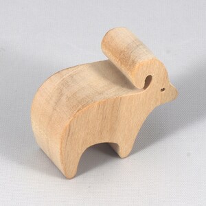 This is an unfinished wooden Ram cutout from solid wood using traditional woodworking techniques. Sanded smooth and ready to paint, stain, or customize. Freestanding design for small hands, toddlers, young children, crafters, collectors, and display. I take custom orders for any animal, quantity, and mix — including large ornament orders. Mix and match, request a different size, or send a drawing or pattern. Handmade by Odin's Toy Factory in Tallahassee, Florida, USA.