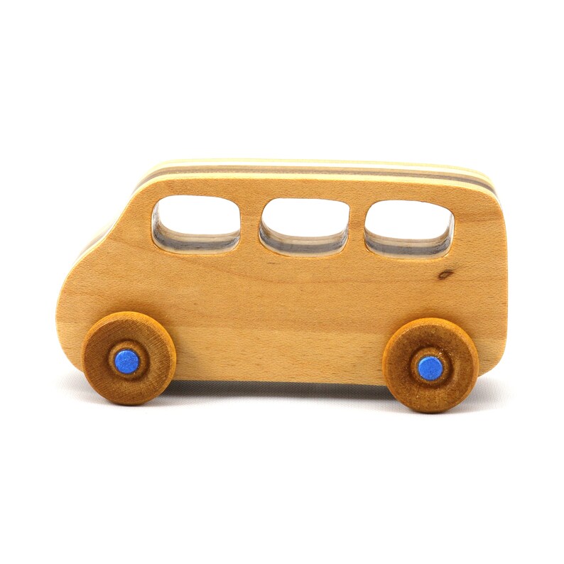 Handmade wood toy minivan made by me in my shop using traditional woodworking tools. It is hand finished with clear shellac with metallic sapphire blue acrylic paint.