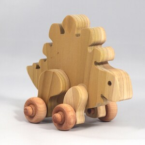 Handmade push toy stegosaurus crafted from select grade hardwoods and finished with a non-toxic coating.