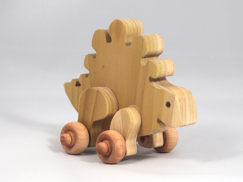 Handmade push toy stegosaurus crafted from select grade hardwoods and finished with a non-toxic coating.