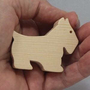 Handmade wood toy Scottie dog cutout unfinished unpainted paintable freestanding Itty Bitty Animal Collection. Approximate size 2.5 inches length by 2 inches height by 0.75 inches width. Handmade in Tallahassee Florida USA from natural wood offcuts.