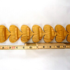 Handmade heart-shaped shelf crafted from reclaimed oak hardwood and finished with polyurethane. Perfect for displaying small items and adding rustic charm to home decor.