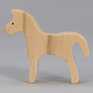 Handmade wooden toy horse cutout, perfect for children's playtime collection. Freestanding and stackable, ready to paint or customize. Endless possibilities for imaginative play, from farm scenes to towering animal creations.