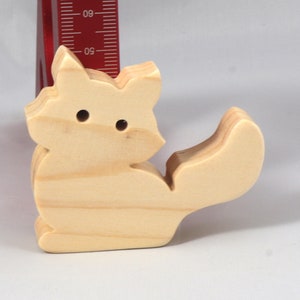 Handmade and unfinished, this stackable toy kitten cat cutout is ready to paint. This unpainted cutout is an excellent option for a fun DIY project or as a pretend toy for children. Available in several sizes, including custom orders.