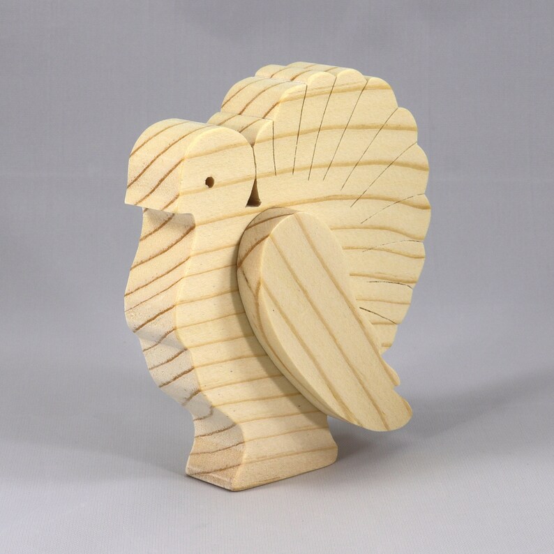 Handmade 3D layered freestanding wooden turkey figurine, unfinished and unpainted. Perfect for Thanksgiving decor, crafts, or as a toy.