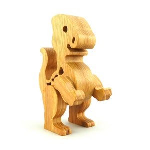 Handmade wooden baby dinosaur figurines, set of 3, made from hardwood with a natural oil and wax finish. Each baby dinosaur measures approximately 3 to 4 inches in height and length. Handmade in Tallahassee, Florida, USA at Odin's Toy Factory.