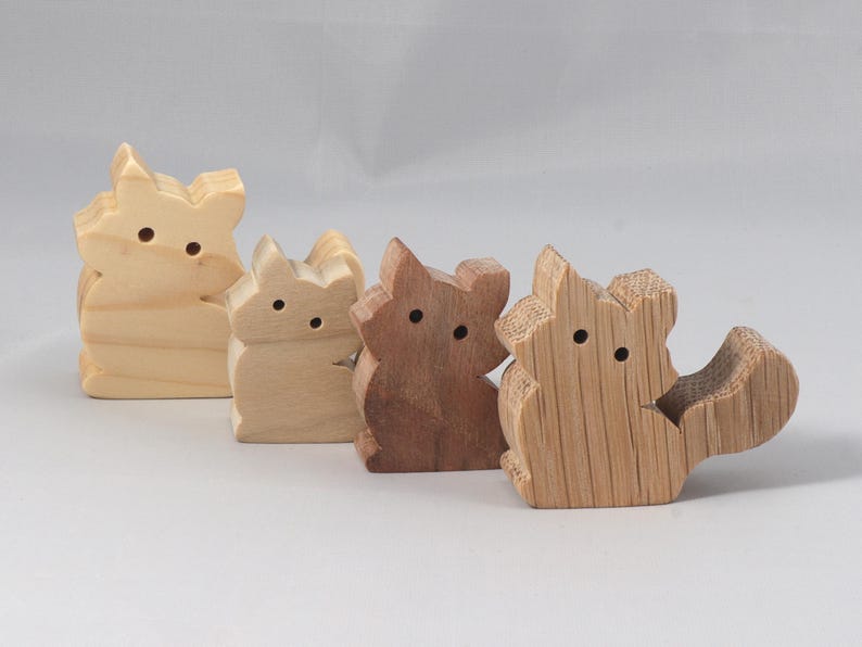 This is an unfinished wooden Fluffy Kitten cutout from solid wood using traditional woodworking techniques. Sanded smooth and ready to paint, stain, or customize. Freestanding design for small hands, toddlers, young children, crafters, collectors, and display. I take custom orders for any animal, quantity, and mix — including large ornament orders. Mix and match, request a different size, or send a drawing or pattern. Handmade by Odin's Toy Factory in Tallahassee, Florida, USA.