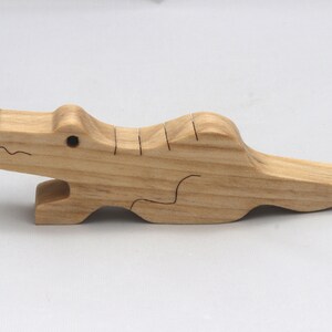 Handmade Wood Alligator Family Stacking Puzzle Mom and five baby (hatchling) alligators. This freestanding puzzle is hand-finished with a custom blend of mineral oil and waxes for a beautiful, smooth, and durable finish.