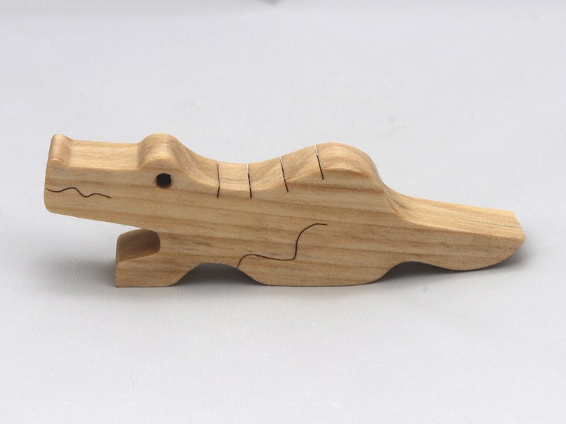 Handmade Wood Alligator Family Stacking Puzzle Mom and five baby (hatchling) alligators. This freestanding puzzle is hand-finished with a custom blend of mineral oil and waxes for a beautiful, smooth, and durable finish.