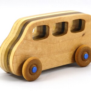 Handmade wood toy minivan made by me in my shop using traditional woodworking tools. It is hand finished with clear shellac with metallic sapphire blue acrylic paint.