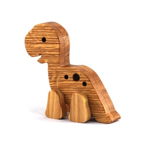 Handmade wooden baby dinosaur figurines, set of 3, made from hardwood with a natural oil and wax finish. Each baby dinosaur measures approximately 3 to 4 inches in height and length. Handmade in Tallahassee, Florida, USA at Odin's Toy Factory.