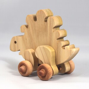 Handmade push toy stegosaurus crafted from select grade hardwoods and finished with a non-toxic coating.