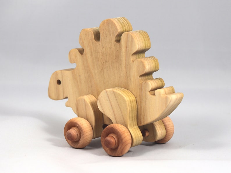 Handmade push toy stegosaurus crafted from select grade hardwoods and finished with a non-toxic coating.