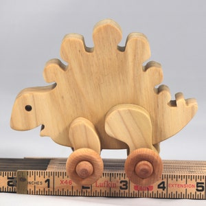 Handmade push toy stegosaurus crafted from select grade hardwoods and finished with a non-toxic coating.