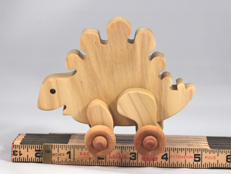 Handmade push toy stegosaurus crafted from select grade hardwoods and finished with a non-toxic coating.