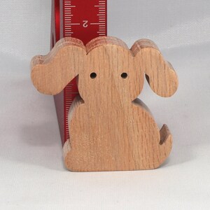 Handmade, stackable toy puppy dog cutout from the Itty Bitty Animal Collection. Unfinished and unpainted, crafted for creative play. Smoothly sanded and ready to be personalized with your favorite colors.