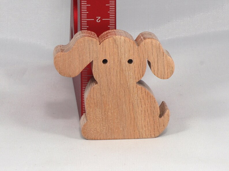 Handmade, stackable toy puppy dog cutout from the Itty Bitty Animal Collection. Unfinished and unpainted, crafted for creative play. Smoothly sanded and ready to be personalized with your favorite colors.