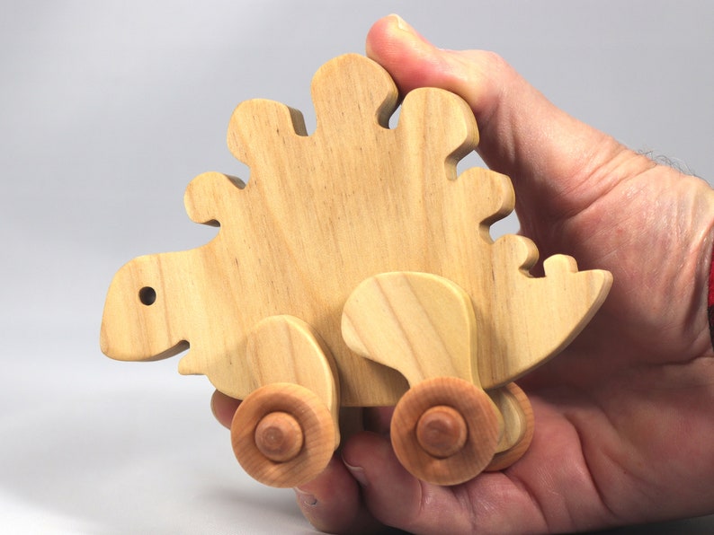 Handmade push toy stegosaurus crafted from select grade hardwoods and finished with a non-toxic coating.