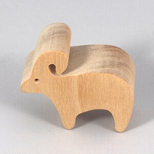 This is an unfinished wooden Ram cutout from solid wood using traditional woodworking techniques. Sanded smooth and ready to paint, stain, or customize. Freestanding design for small hands, toddlers, young children, crafters, collectors, and display. I take custom orders for any animal, quantity, and mix — including large ornament orders. Mix and match, request a different size, or send a drawing or pattern. Handmade by Odin's Toy Factory in Tallahassee, Florida, USA.