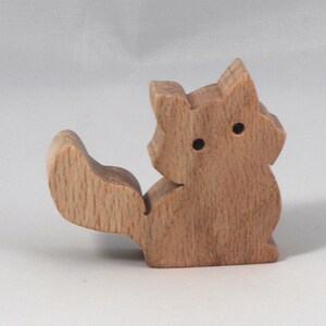 Handmade and unfinished, this stackable toy kitten cat cutout is ready to paint. This unpainted cutout is an excellent option for a fun DIY project or as a pretend toy for children. Available in several sizes, including custom orders.