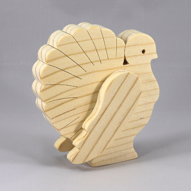 Handmade 3D layered freestanding wooden turkey figurine, unfinished and unpainted. Perfect for Thanksgiving decor, crafts, or as a toy.