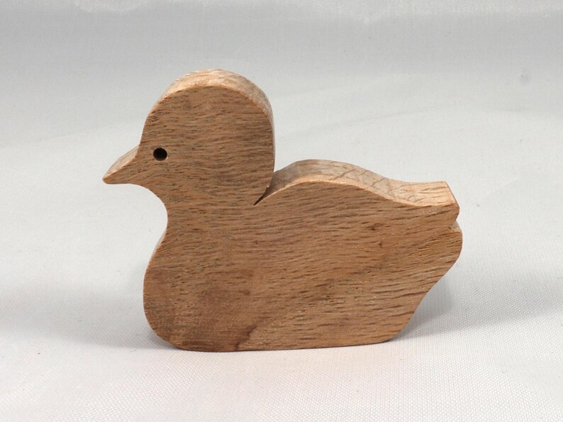 This is an unfinished wooden Duck cutout from solid wood using traditional woodworking techniques. Sanded smooth and ready to paint, stain, or customize. Freestanding design for small hands, toddlers, young children, crafters, collectors, and display. I take custom orders for any animal, quantity, and mix — including large ornament orders. Mix and match, request a different size, or send a drawing or pattern. Handmade by Odin's Toy Factory in Tallahassee, Florida, USA.