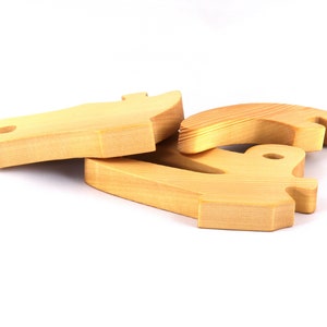 A 10-inch long wooden alligator puzzle for younger kids handmade and smoothly finished. This simple puzzle has three pieces, easy-to-grasp, interlocking, chunky, freestanding pieces. It is made to order.